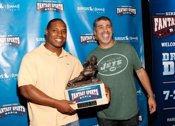 61109778 Jacksonville Jaguars RB Maurice Jones-Drew and Gary Dell'Abate of the Howard Stern Show pose with the Throwback trophy before the start of the Sirius XM fantasy football draft.
